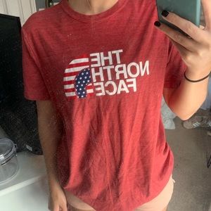 Red The North Face T-Shirt, size adult medium.